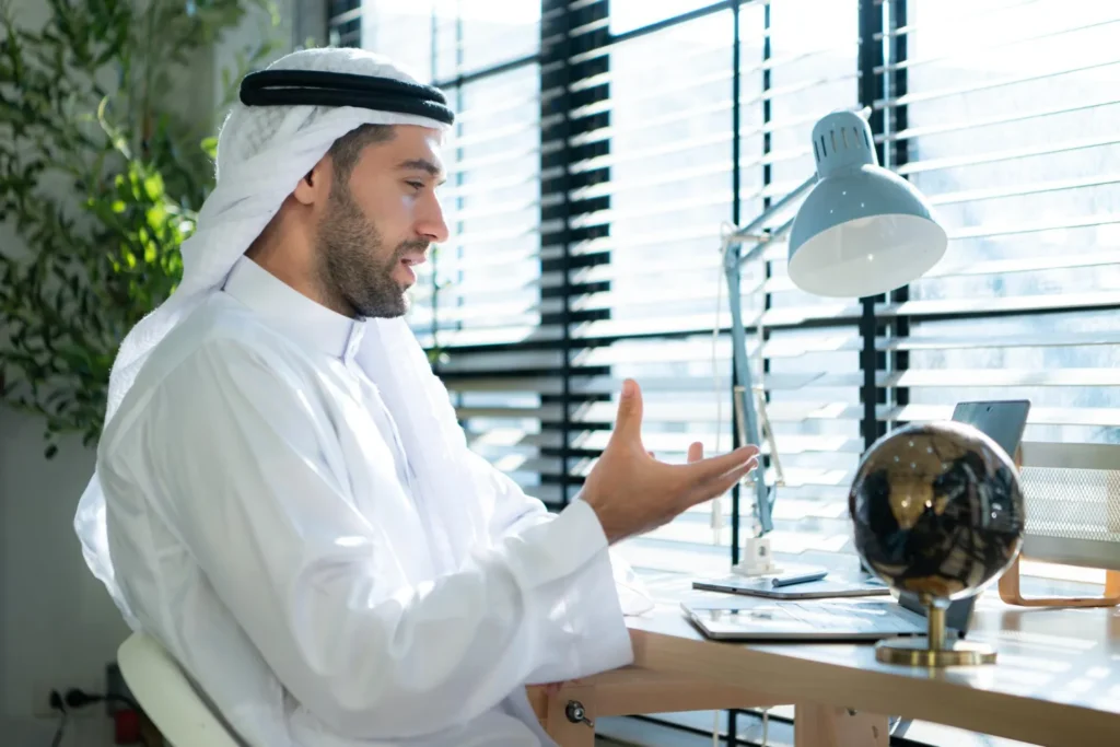 Business professional reviewing documents beside an office window