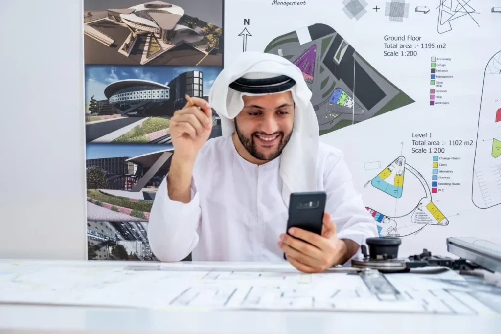 Business professional reviewing documents and financial information in Abu Dhabi
